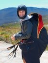 Paragliding, parachute or man in nature in portrait, smile or strings for exercise for health support. Athlete, face and
