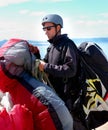 Paragliding, parachute or man in nature for sport, preparation or helmet to exercise for health support. Athlete