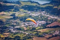 Paragliding in paradise landscape with volcano crater and lagoon in Azores. Paraglider above Lagoa das Furnas, Sao Miguel, Azores