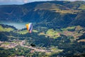 Paragliding in paradise landscape with volcano crater and lagoon in Azores. Paraglider above Lagoa das Furnas, Sao Miguel, Azores