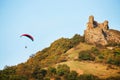 A man flies in his paraglider near Siria Medieval Fortress in Arad County, Romania.