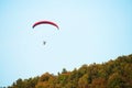 A man flies in his paraglider near Siria Medieval Fortress in Arad County, Romania.