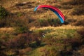 A man flies in his paraglider near Siria Medieval Fortress in Arad County, Romania.