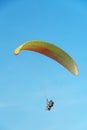 Paragliding in the sky over the sea. The concept of parachute flight. Tandem skydiver pilot and passenger fly on a sunny day Royalty Free Stock Photo