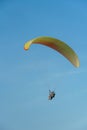 Paragliding in the sky over the sea. The concept of parachute flight. Tandem skydiver pilot and passenger fly on a sunny day Royalty Free Stock Photo
