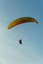 Paragliding in the sky over the sea. The concept of parachute flight. Tandem skydiver pilot and passenger fly on a sunny day Royalty Free Stock Photo