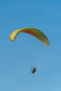 Paragliding in the sky over the sea. The concept of parachute flight. Tandem skydiver pilot and passenger fly on a sunny day Royalty Free Stock Photo