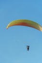 Paragliding in the sky over the sea. The concept of parachute flight. Tandem skydiver pilot and passenger fly on a sunny day Royalty Free Stock Photo