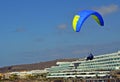 Paragliding in the sky.Paraglider flying over La Caleta village in south Tenerife island,Canary islands,Spain. Royalty Free Stock Photo