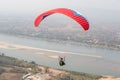 Paragliding in the sky. Paraglider  flying over Landscape from Beautiful View Mekong River Royalty Free Stock Photo