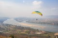 Paragliding in the sky. Paraglider  flying over Landscape from Beautiful View Mekong River Royalty Free Stock Photo