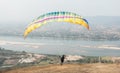 Paragliding in the sky. Paraglider flying over Landscape from Beautiful View Mekong River Royalty Free Stock Photo