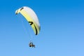 Paragliding sport flight on soaring wing in clear blue sky Royalty Free Stock Photo