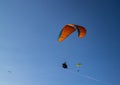 Paragliders against a blue clear sky in Portugal with copy space