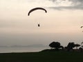 Paragliding during sunset observed from the top of mountain in Lima, Peru.