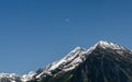 Paragliding in the Swiss Alps above snow covered peaks Royalty Free Stock Photo