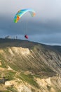 Paragliding in tandem in the clouds above the mountains Royalty Free Stock Photo