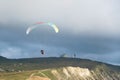 Paragliding in tandem in the clouds above the mountains Royalty Free Stock Photo