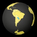 Paraguay on dark globe with yellow world map.