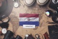 Paraguay Flag Between Traveler`s Accessories on Old Vintage Map. Overhead Shot