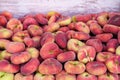 Paraguayan sweet peaches stacked in a container box to the raw for sale Royalty Free Stock Photo