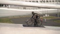 Parallax, camera movement side. Figurine cyclist, background cycle track