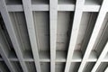 Parallel concrete support beams under a bridge Royalty Free Stock Photo