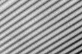 Parallel diagonal black and white gradient lines. Abstract background. Sun shutters shadow on wallpaper. Light and shade play Royalty Free Stock Photo