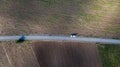 Parallel lines from an aerial view of farm land and a dirt road. drone picture of gravel road that splits two field. Agriculture f Royalty Free Stock Photo