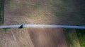 Parallel lines from an aerial view of farm land and a dirt road. drone picture of gravel road that splits two field. Agriculture f Royalty Free Stock Photo