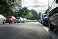 Parallel parking cars on urban street. Outdoor parking on road