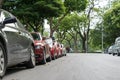 Parallel parking cars on urban street. Outdoor parking on road