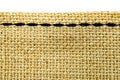 Ough woven fabric, stitched with black thread Royalty Free Stock Photo