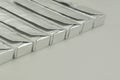 Paralleled chocolate bars in silver packaging on background Royalty Free Stock Photo