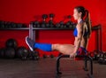 Parallettes woman parallel bars workout at gym