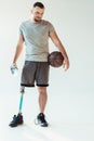 paralympic basketball player with sportive water bottle and basketball ball Royalty Free Stock Photo