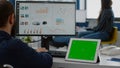 Paralyzed manager analysing statistics looking at tablet with izolated display