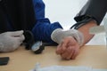 A paramedic checking patient's blood pressure