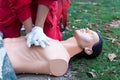 Paramedic demonstrate Cardiopulmonary resuscitation - CPR on dummy. First aid training. Royalty Free Stock Photo