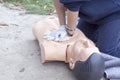 Paramedic demonstrates CPR on a dummy