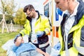 Paramedic and emergency doctor caring for injured boy Royalty Free Stock Photo