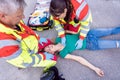 Paramedic and emergency doctor at site of traffic accident