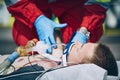 Paramedic of emergency medical service helping man after resuscitation Royalty Free Stock Photo