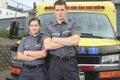 Paramedic employee with ambulance in the Royalty Free Stock Photo