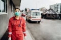 Paramedic in front of isolation hospital facility.Coronavirus Covid-19 heroes.Mental strength of medical professional.Emergency Royalty Free Stock Photo