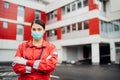 Paramedic in front of isolation hospital facility.Coronavirus Covid-19 heroes.Mental strength of medical professional.Emergency