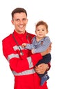 Paramedic holding baby boy