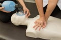 Paramedic practicing Cardiopulmonary resuscitation, CPR on a dum Royalty Free Stock Photo