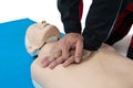 Paramedic practicing resuscitation on dummy