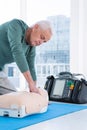 Paramedic practicing resuscitation on dummy Royalty Free Stock Photo